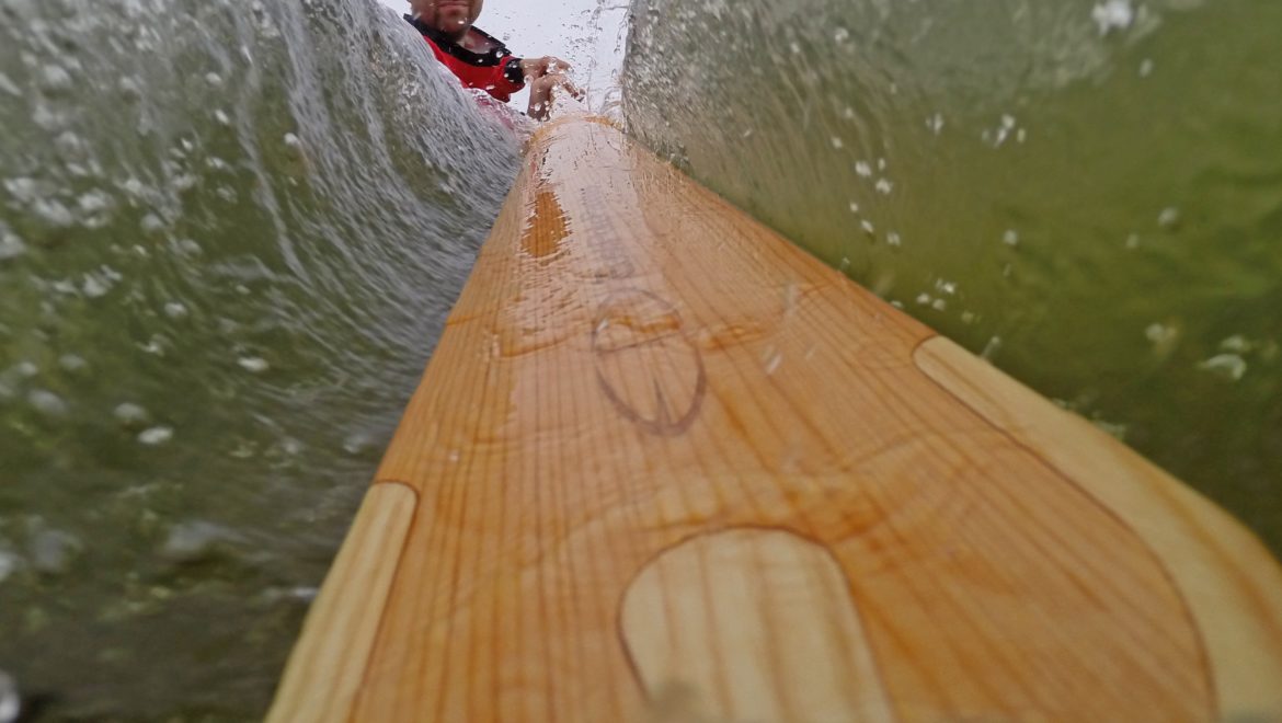 greenland paddle into the water